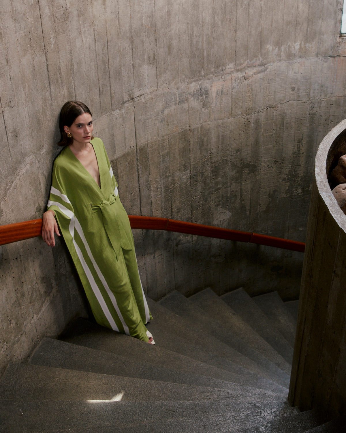 Model wearing the Solid-Green-Long-Kaftan-With-Sash-Concept styled for a resort look