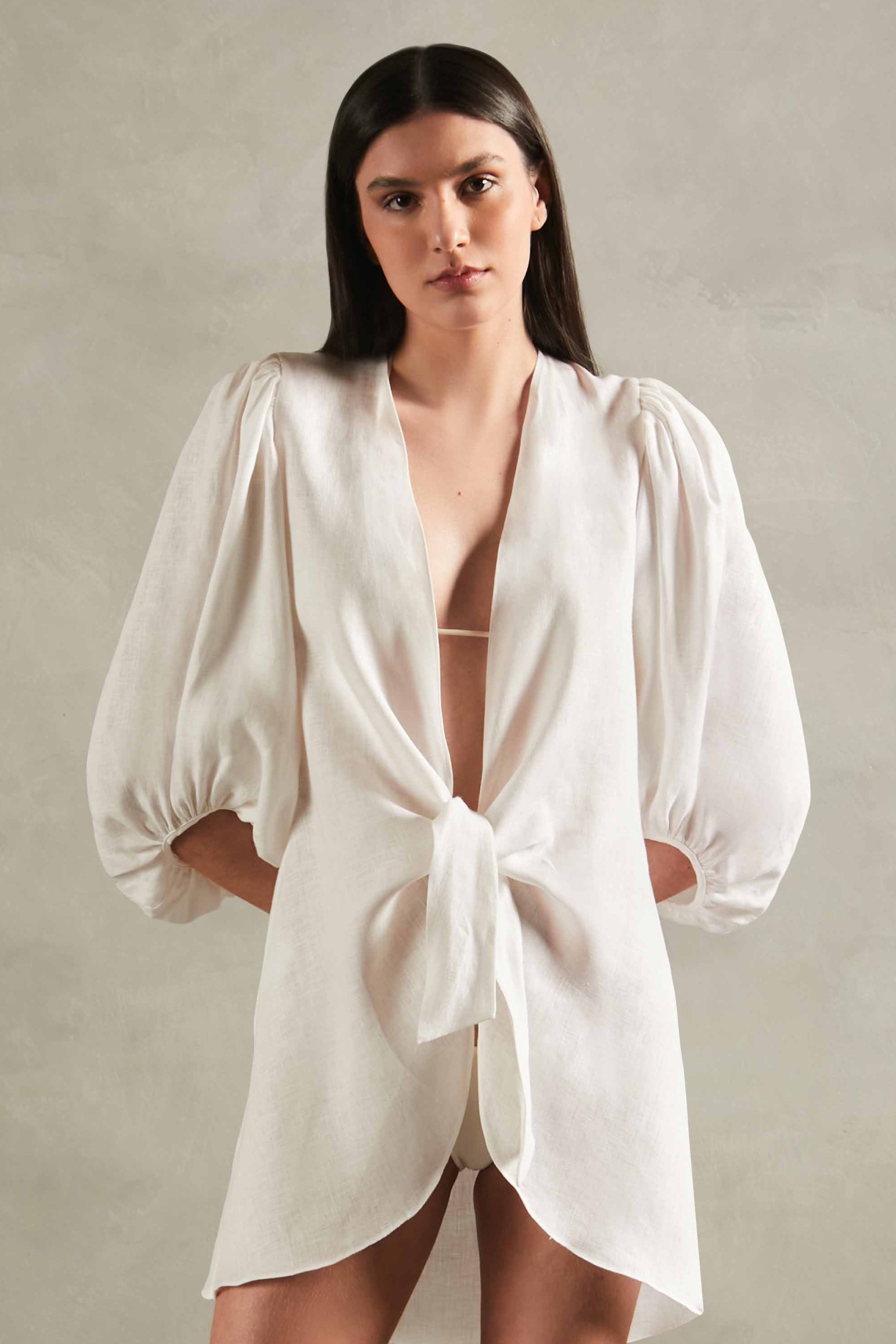 Model wearing the Solid Shirt With Voluminous Sleeves color off white front with 100% linen fabric, styled for a resort look.