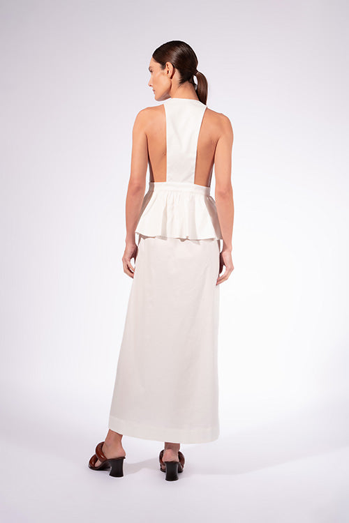 Model wearing the Solid Deep V-Neck Peplum Maxi Dress back color off white made with 97% Cotton 3% Elastane, styled for resortwear look