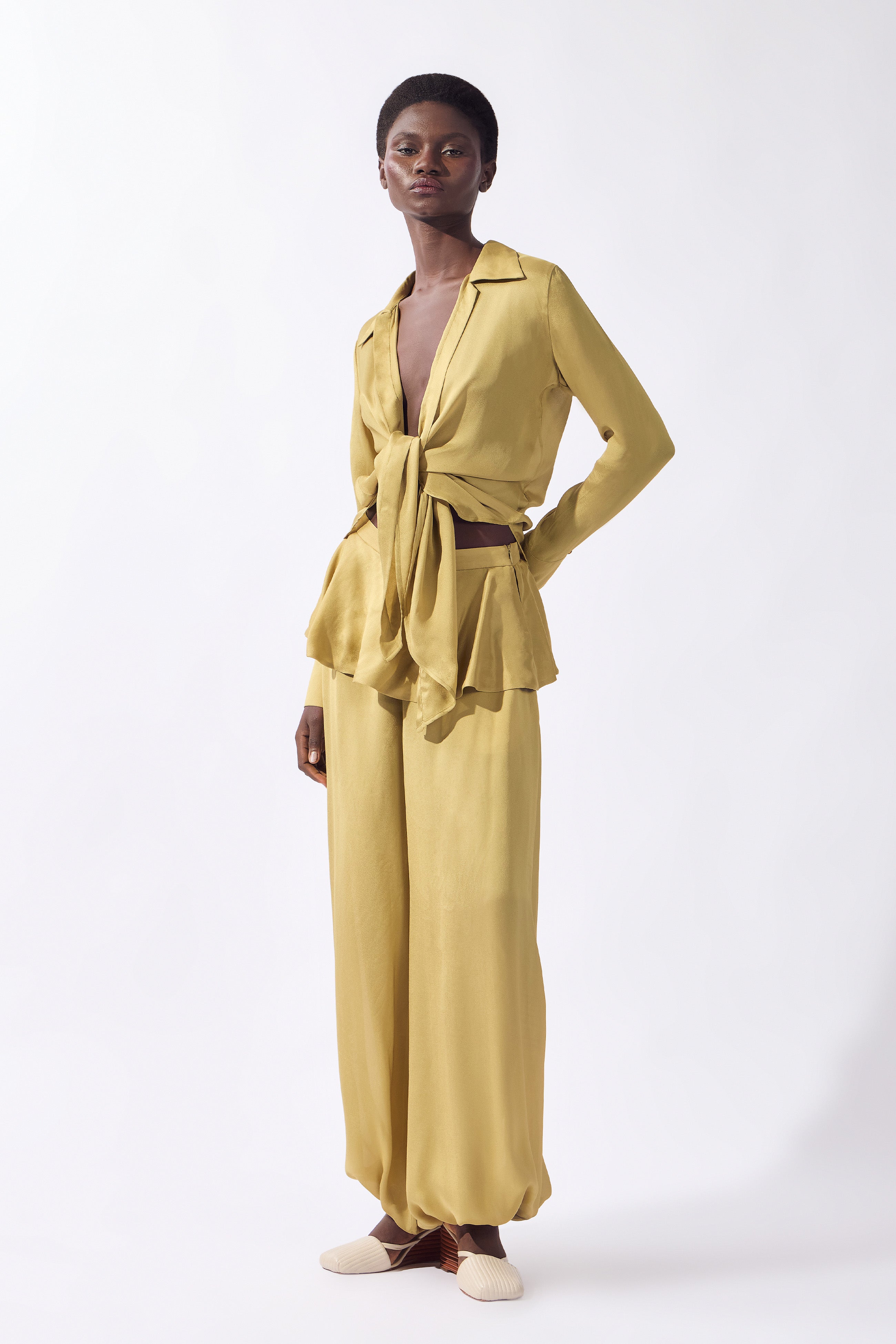 Model wearing the Solid Front-Tie Shirt look color pistachio, made from 100% viscose, styled for a dinner look