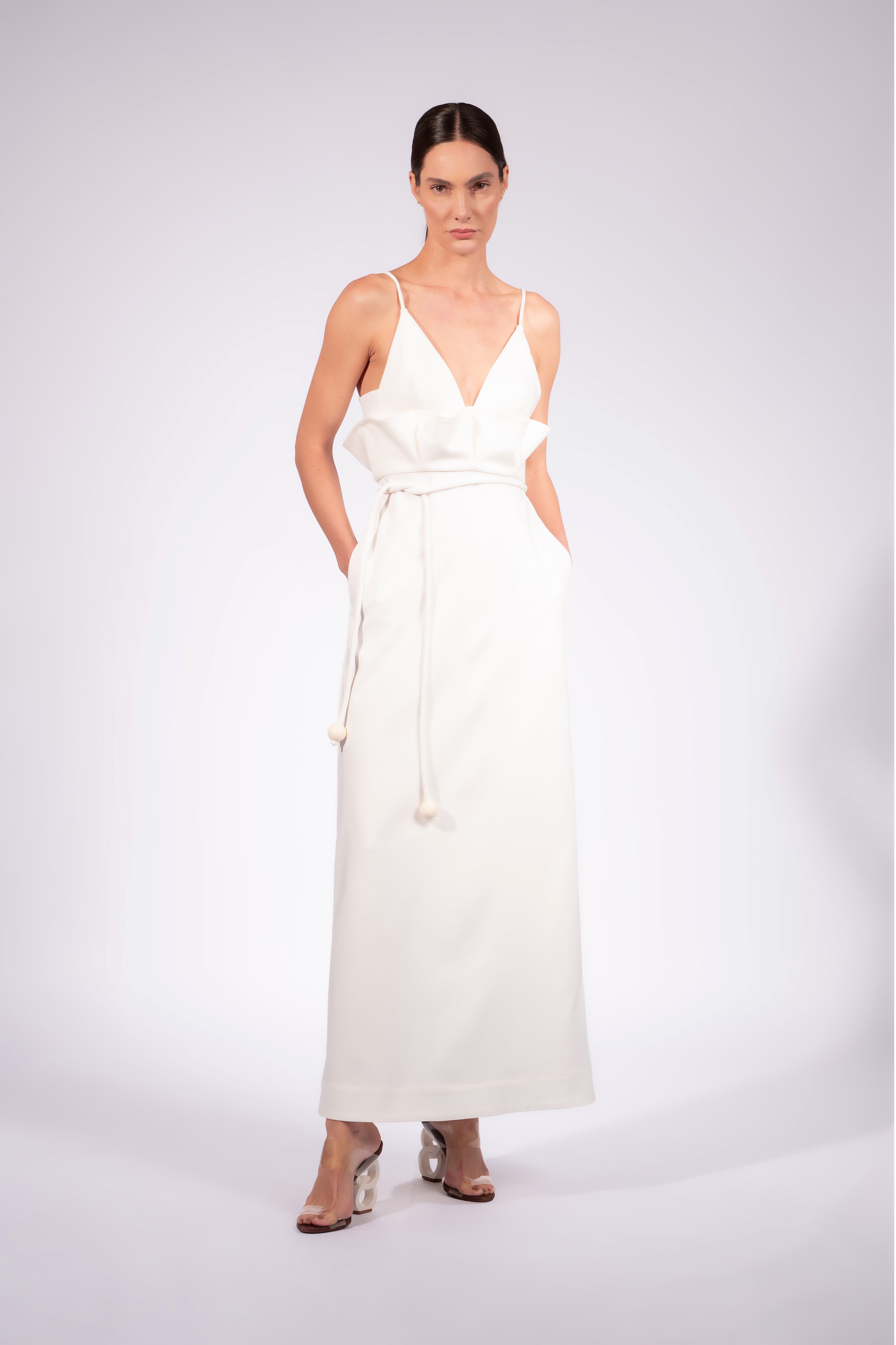 Model wearing the Solid Maxi Dress front front color off white made with 52% Cotton 45% Polyamide 3% Elastane, styled for resortwear look