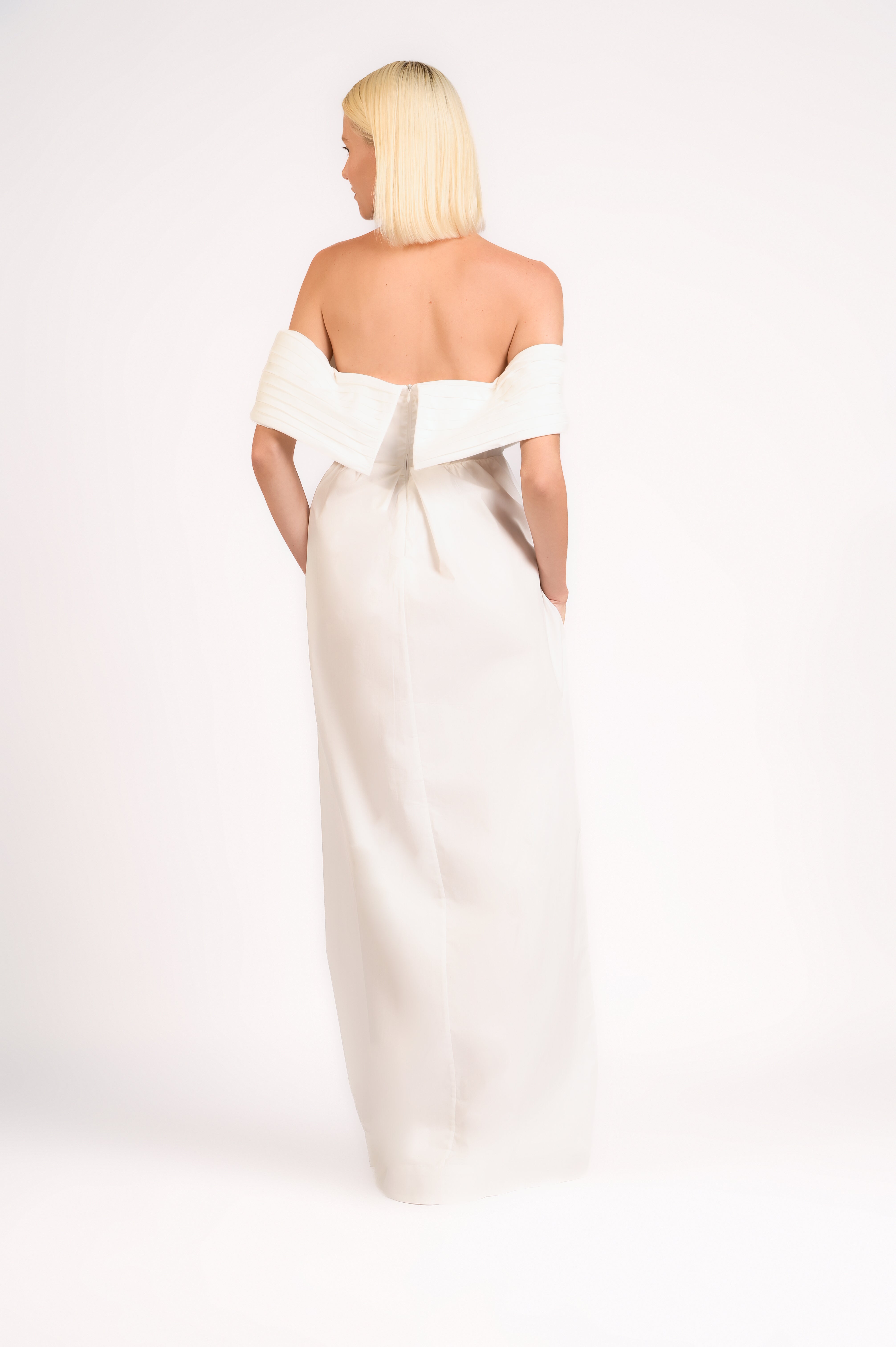 Model wearing the Solid Off-The-Shoulder Maxi Dress color off white made from 97% cotton 3% elastane, styled for a party look