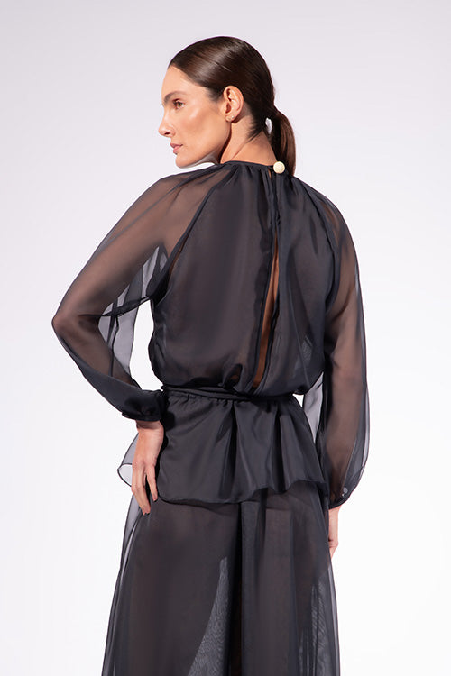 Model wearing the Solid Peplum Maxi Dress back color navy made with 100% Cotton, styled for resortwear look