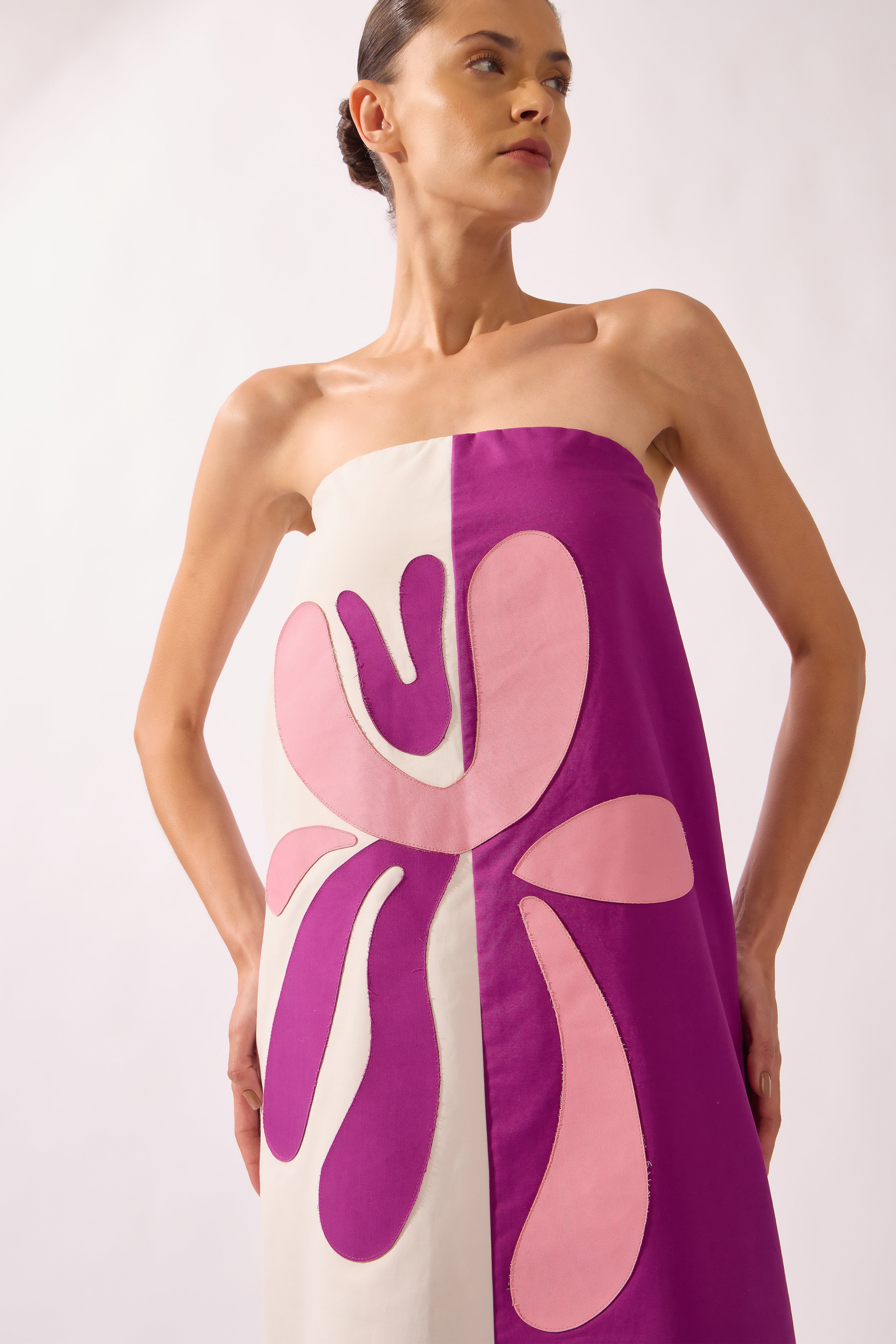 Model wearing the Strapless Maxi Dress petal detail color off white, made from 97% cotton 03% elastane, styled for a dinner look