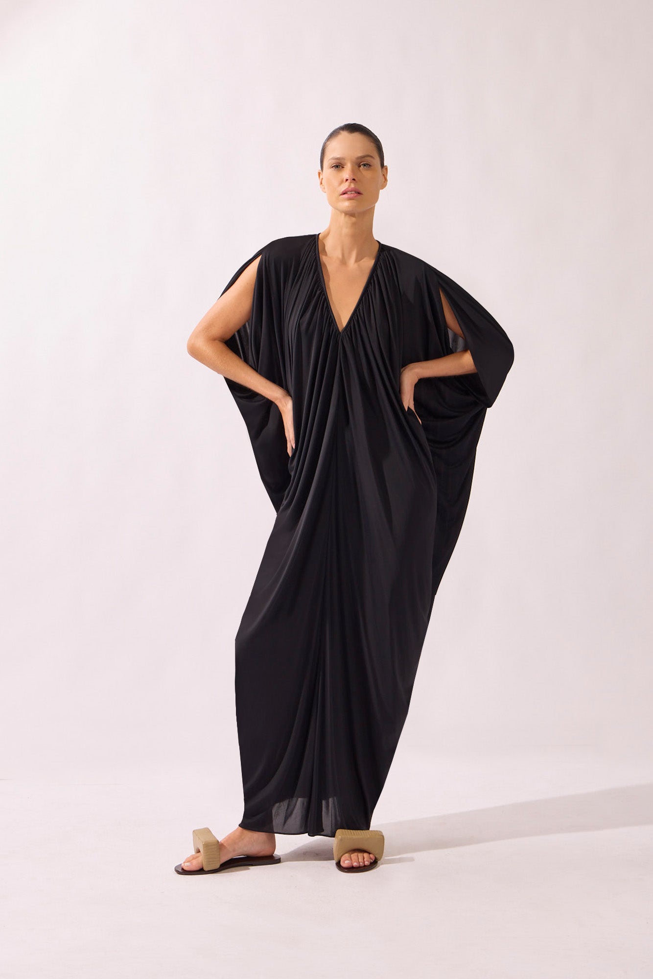 Model wearing the V-Neck Jersey Maxi Dress front color black, made from 100% polyamide, styled for a resort look