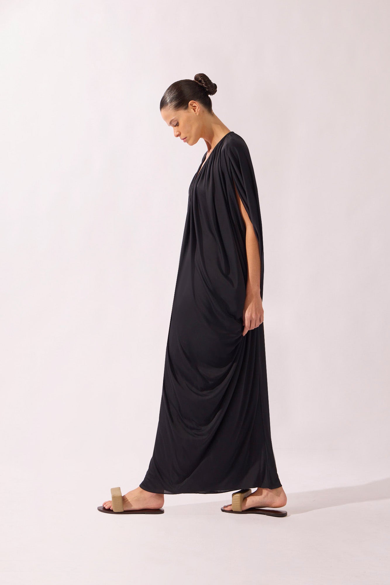 Model wearing the V-Neck Jersey Maxi Dress side color black, made from 100% polyamide, styled for a resort look