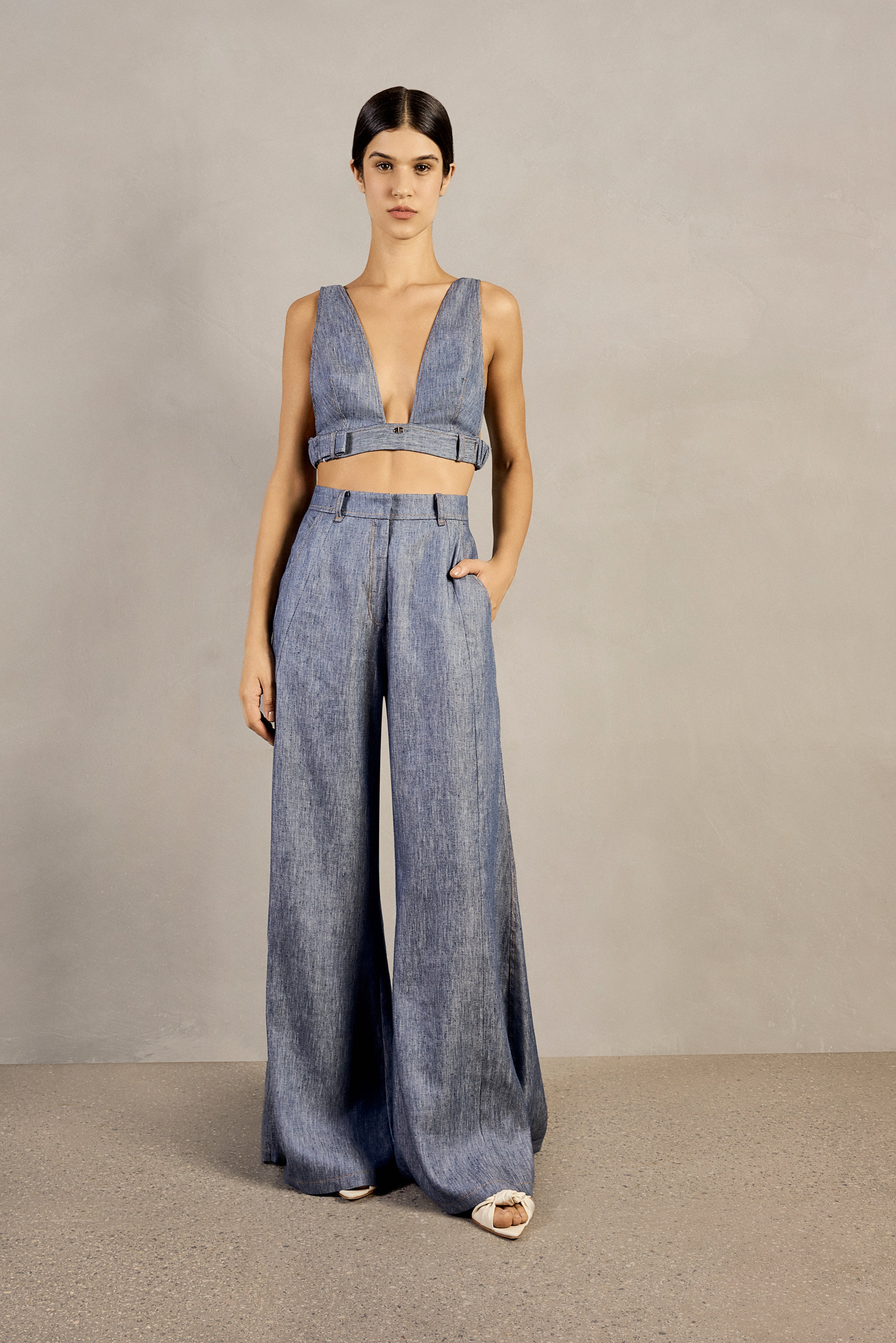 Front view of Adriana Degreas' Jeans Wide-Leg Pants in denim-inspired blue, featuring a high-waist design, wide legs, and side pockets.