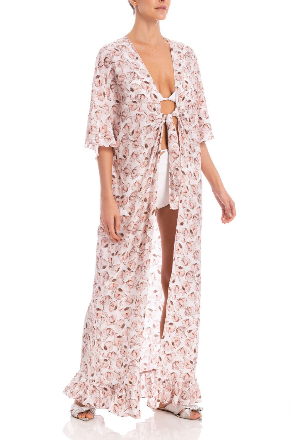 Model wearing the Aglio Long Kaftan With Knot showcasing the front of it's midi sleeved piece, with Aglio Print, on a silk fabric.