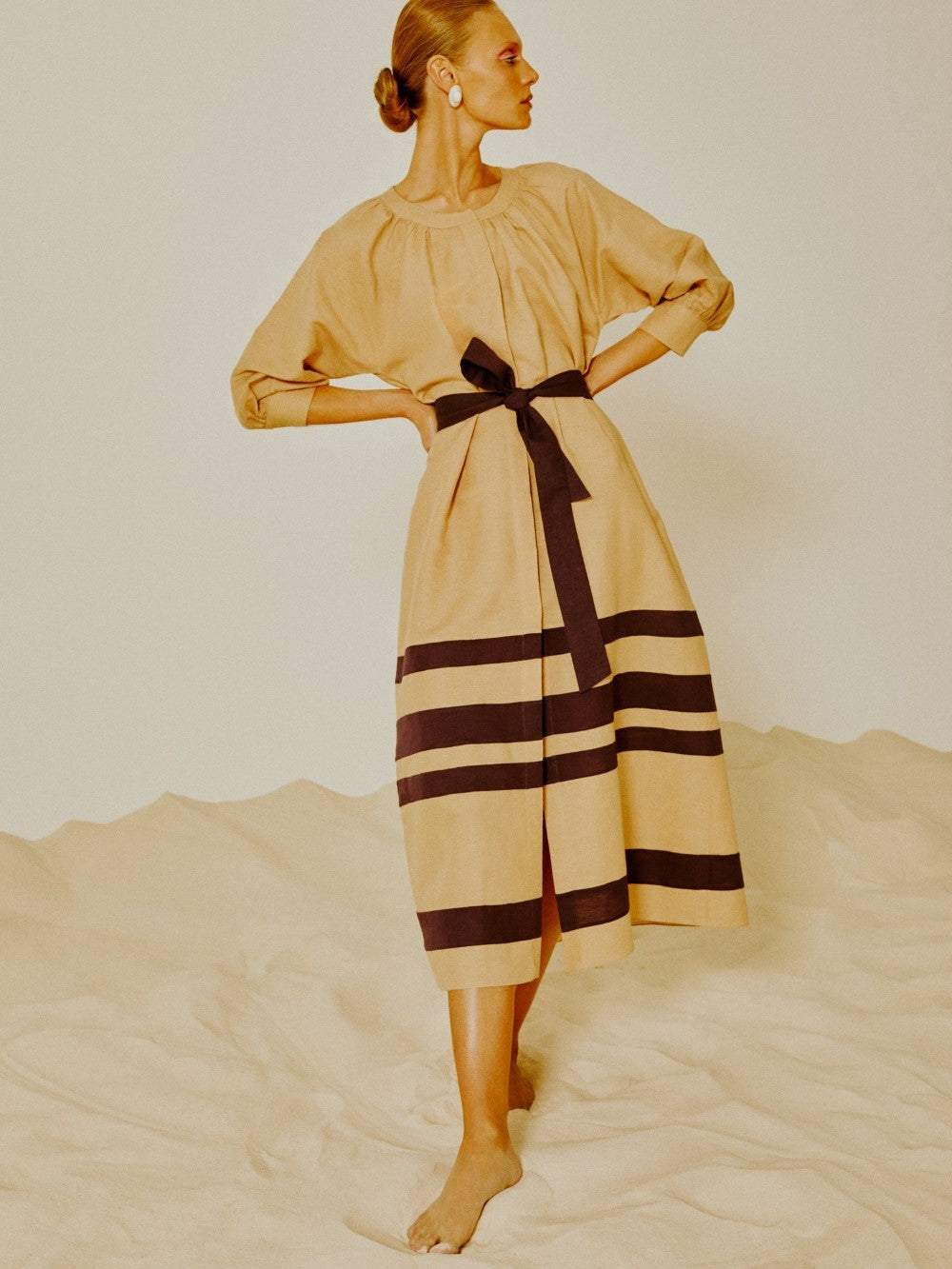 Crafted from linen, this dress come with a matching belt or can be worn unbuttoned as part of a layered look