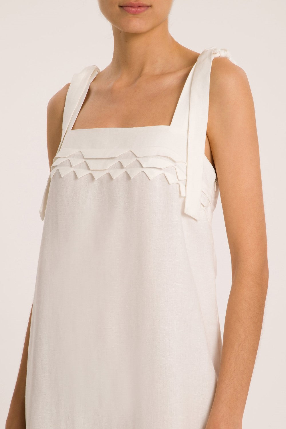 Think about effortless chic pieces to wear day and night like this long dress with handmade details