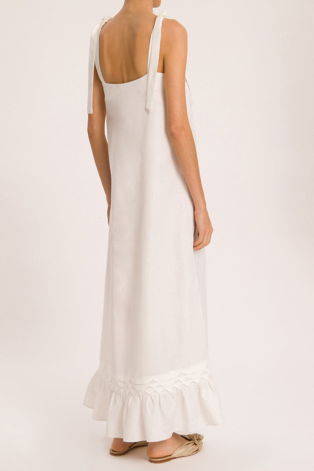Think about effortless chic pieces to wear day and night like this long dress with handmade details