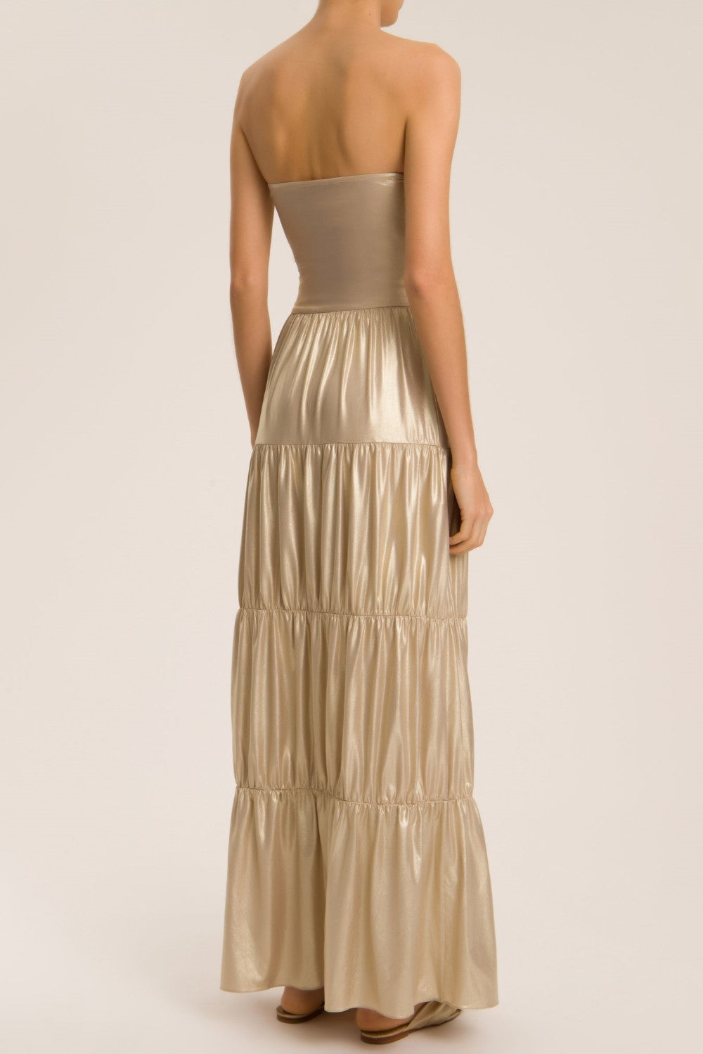 This long skirt is made of lightweight metallic fabric and can be worn in so many ways