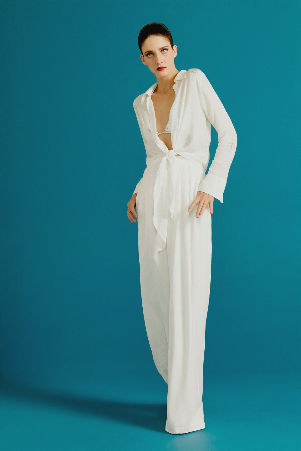 Adriana Degreas has an elegant approach to beach wear with key pieces like this wide leg silhouette silk pants