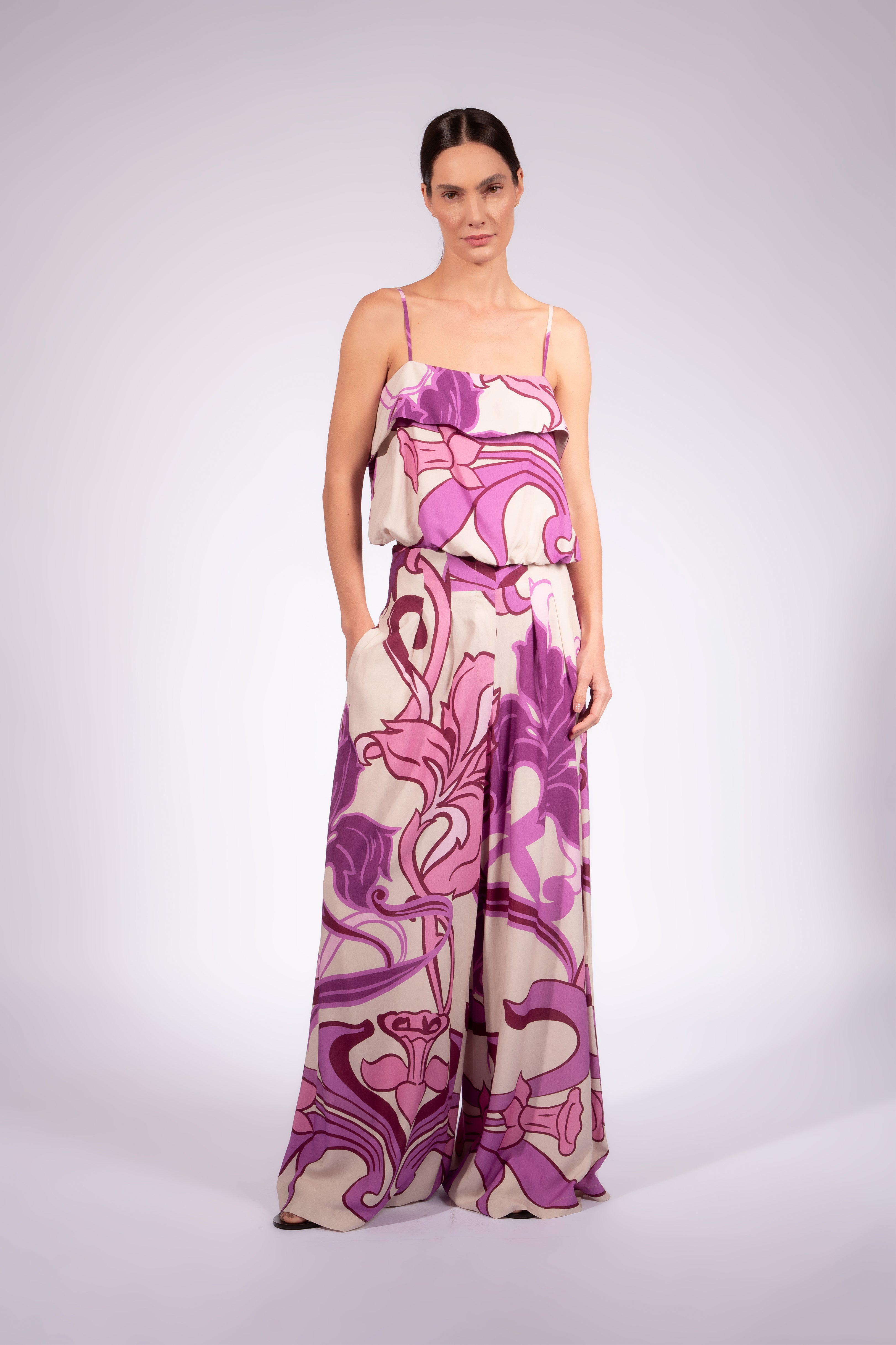 Model wearing the Alpine Flower Wide-Leg Pants front made from 100% viscose fabric, styled for a resort look