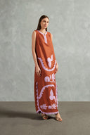 Model wearing the Appliqué Midi Tunic Front showcasing its Cognac and Lilac print on 55% Linen 45% Viscose fabric, styled for an afternoon look.