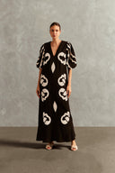 Model wearing the Appliqué V-Neck Long Dress Front showcasing its Black  print on 55% Linen 45% Viscose fabric, styled for an afternoon look.
