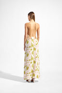 Model wearing the Balearic Bare Back Maxi Dress back showcasing its unique color on 100% Viscose fabric, styled for an evening look.  