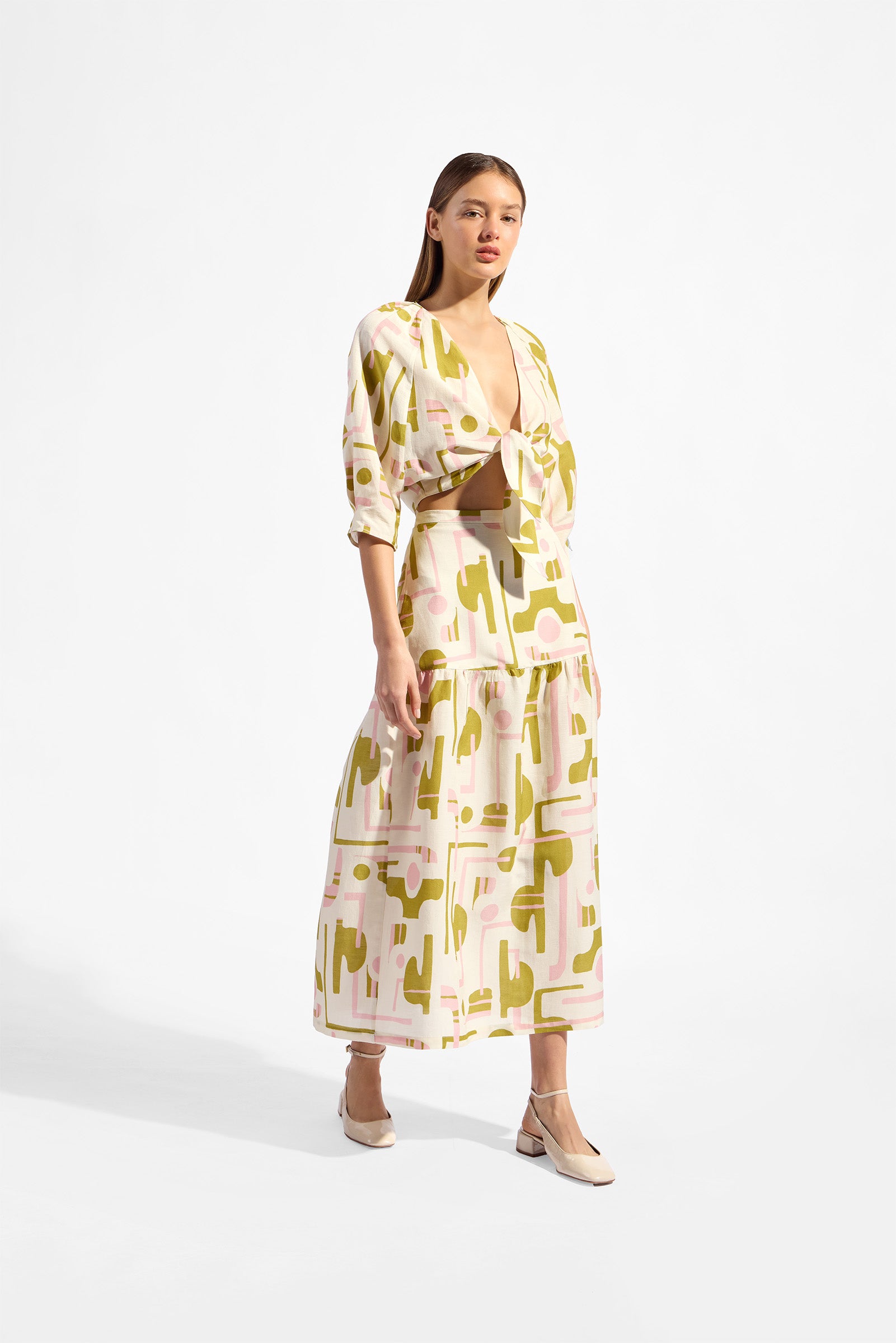 Model wearing the Balearic Midi Skirt look color unique made with 56% viscose 44% Linen, styled for resortwear look