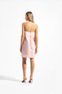 Model wearing the Balearic Mosaic Mini Dress color light pink, made from 100% ramie, styled for a drinks by the pool look