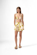 Model wearing the Balearic Pleated Shorts front color navy made with 56% viscose 44% Linen, styled for resortwear look