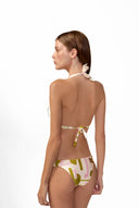 Model wearing the Balearic Triangle Bikini back color unique with 85% Polyamide 15% Elastane, styled for a beachwear look