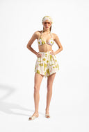 Model wearing the Balearic Triangle Bikini look color unique with 85% Polyamide 15% Elastane, styled for a beachwear look