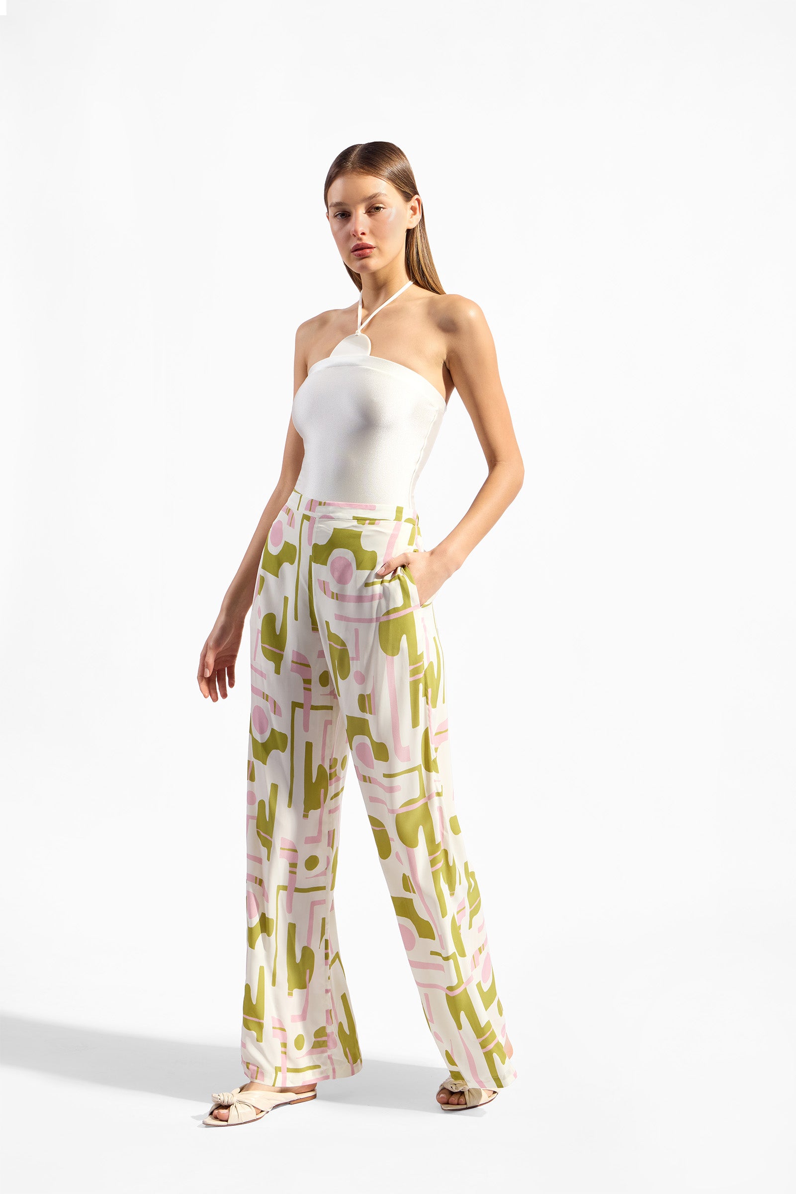 Model wearing the Balearic Wide-Leg Pants look color unique, made with 100% viscose fabric, styled for resortwear look 
