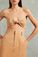 Model wearing the Bicolor Solid Midi Skirt Detail showcasing its Beige print on 100% Cotton fabric, styled for an afternoon look.