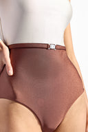 Model wearing the Bicolor Strapless Swimsuit color detail cappuccino with 85% Polyamide 15% Elastane styled for a beachwear look