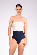 Model wearing the Bicolor Strapless Swimsuit color navy with 85% Polyamide 15% Elastane styled for a beachwear look