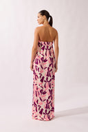 Model wearing the Bold Floral Neck-Tie Maxi Dress back unique, made from 100% viscose, styled for a beachwear look