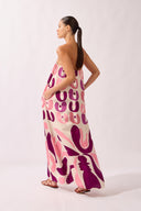 Model wearing the Bold Floral Strapless Maxi Dress back color unique, made from 100% viscose, styled for a resort look