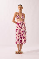 Model wearing the Bold Floral Wrap Pareo front color unique, made from 100% viscose, styled for a beachwear look