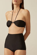 Model wearing the Solid High-Waisted Bikini Set detail, made from 85% polyamide 15% elastane, styled for a beachwear look