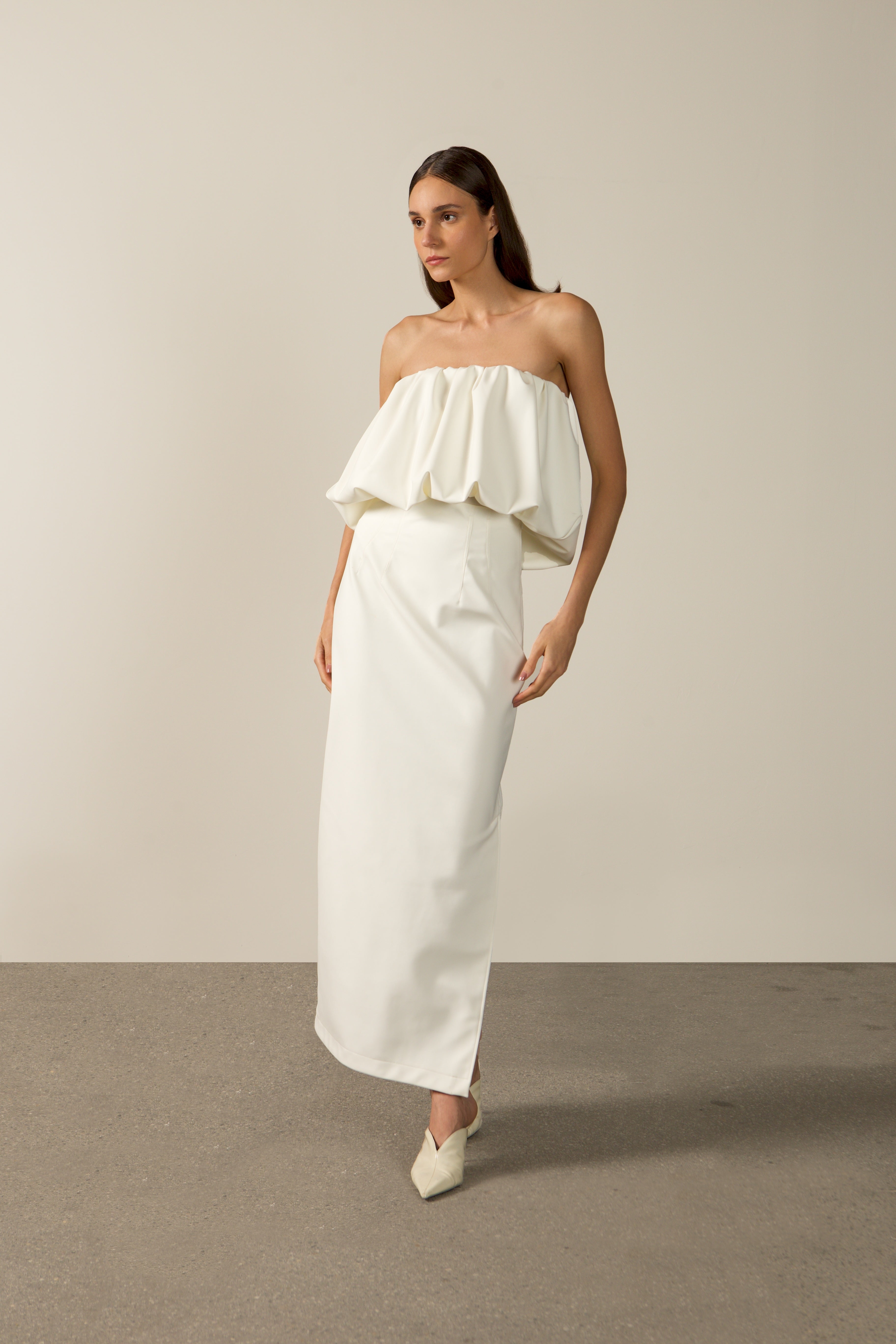 Model wearing the Coquille De Mer Long Skirt off white styling from the HS25 with 76.3% Polyamide 23.7% Elastane styled for an evening look.