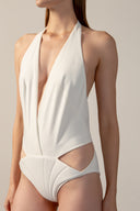 Model wearing the Coquille De Mer Plunge-Neck Swimsuit off white detail from the HS25 with 76.3% Polyamide 23.7% Elastane styled for a pool party look.   