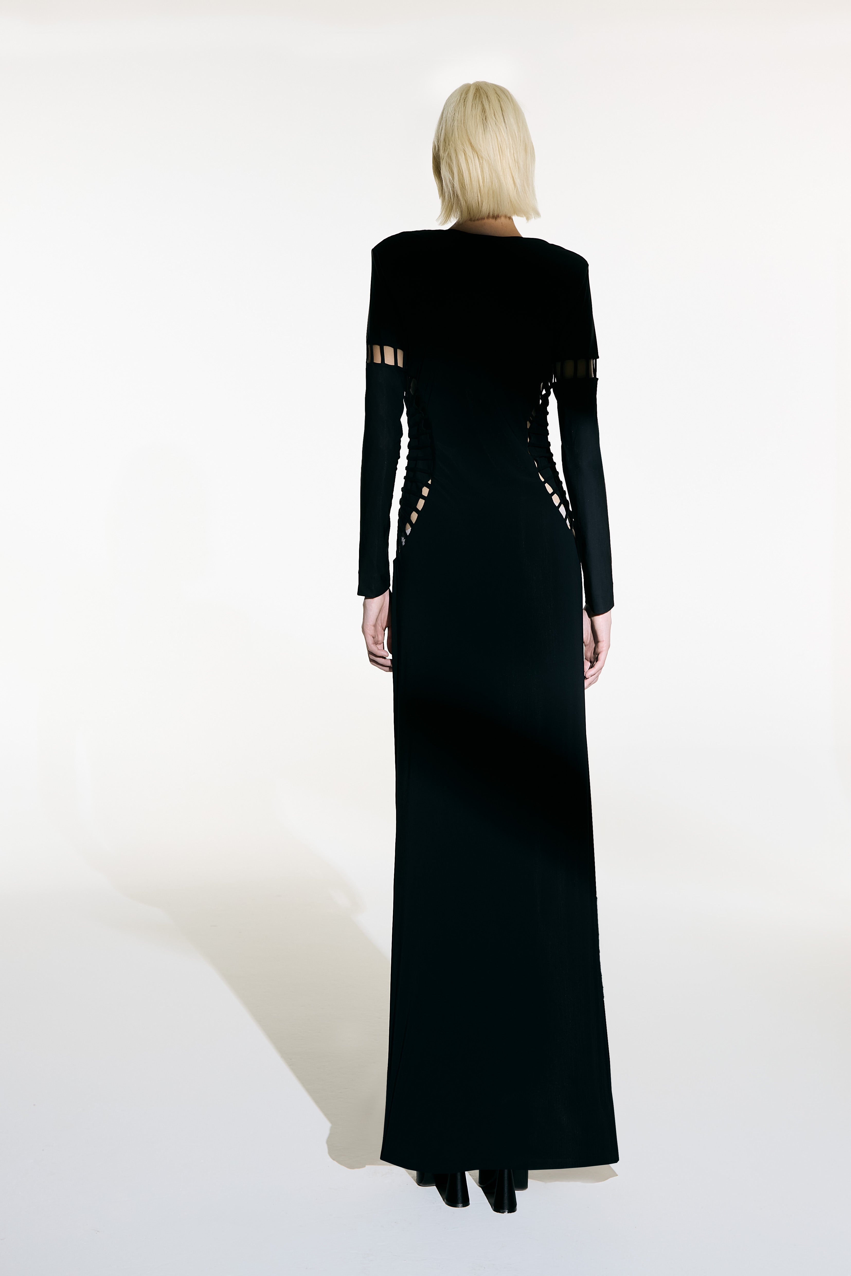 Model wearing the  Cut-Out Plunge Maxi Dress back from the Adriana Degreas and Sabine Getty collab with 75% Polyamide 25% Elastane styled for a dinner look.