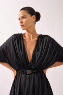 Model wearing the Dolman Jersey Blouse detail color black, made from 100% polyamide, styled for a resort look