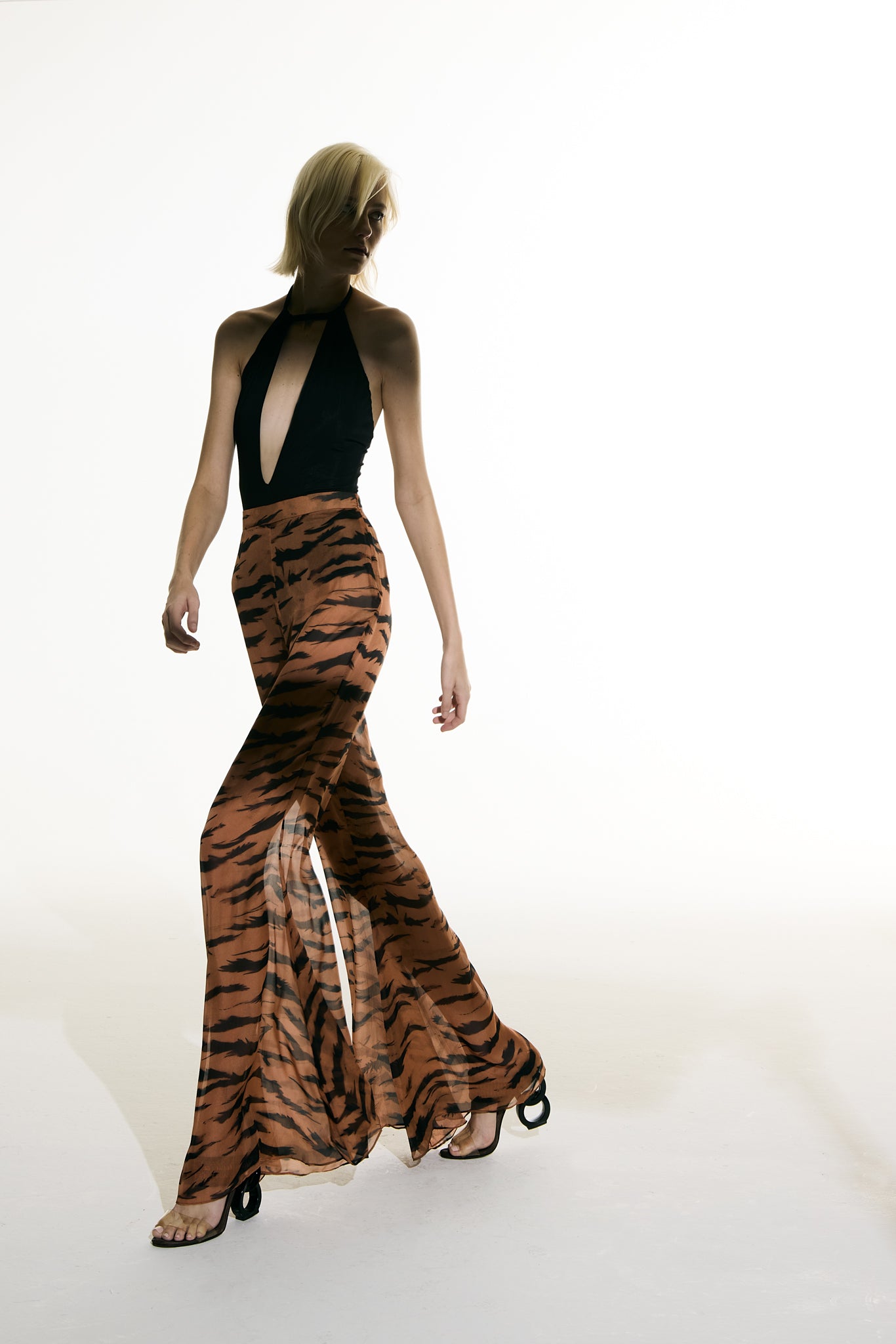 Model wearing the Flared Silk Pants concept from the Adriana Degreas and Sabine Getty collab with 100% Silk styled for a casual look.