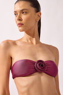 Model wearing the Flower Appliqué Bikini close up color fuchsia, made from 85% polyamide 15% elastane, styled for a beachwear look