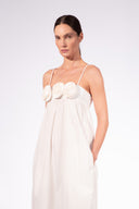 Model wearing the Flower Appliqué Midi Dress detail color black made with 97% Cotton 3% Elastane, styled for resortwear look