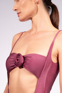 Model wearing the Flower Appliqué Swimsuit detail, made from 85% polyamide 15% elastane, styled for a beachwear look