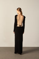 Model wearing the Geometric Long-Sleeved Bare-Back Long Dress black back from the HS25 with 92% Polyester 8% Polyamide styled for a date look.   