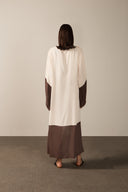 Model wearing the Geometric Long Robe brown color back from the HS25 with 100% viscose styled for a drinks at the boat look. 