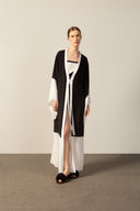 Model wearing the Geometric Long Robe brown black front from the HS25 with 100% viscose styled for a drinks at the boat look. 