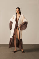 Model wearing the Geometric Long Robe brown color pose from the HS25 with 100% viscose styled for a drinks at the boat look. 