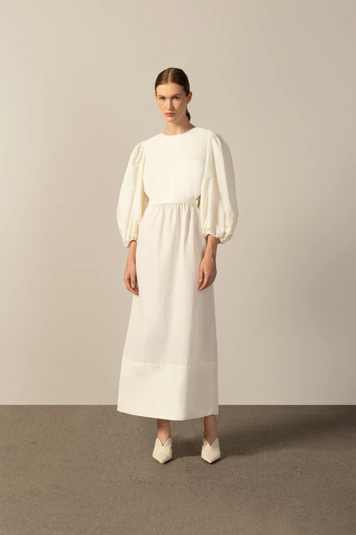 Model wearing the Geometric Puff-Sleeved Long Dress color off white with 98% cotton and 2% elastane fabric styled for a resort look