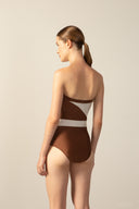 Model wearing the Geometric Strapless Swimsuit cappuccino color back from the HS25 with 85% Polyamide 15% Elastane styled for a beach look.  