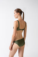 Model wearing the Geometric Straps Bikini croco green back from the HS25 with 85% Polyamide 15% Elastane styled for a beach look.  