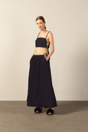 Model wearing the Geometric Top and Voluminous Skirt Set navy front from the HS25 with 100% polyester styled for a walk at the museum look.   